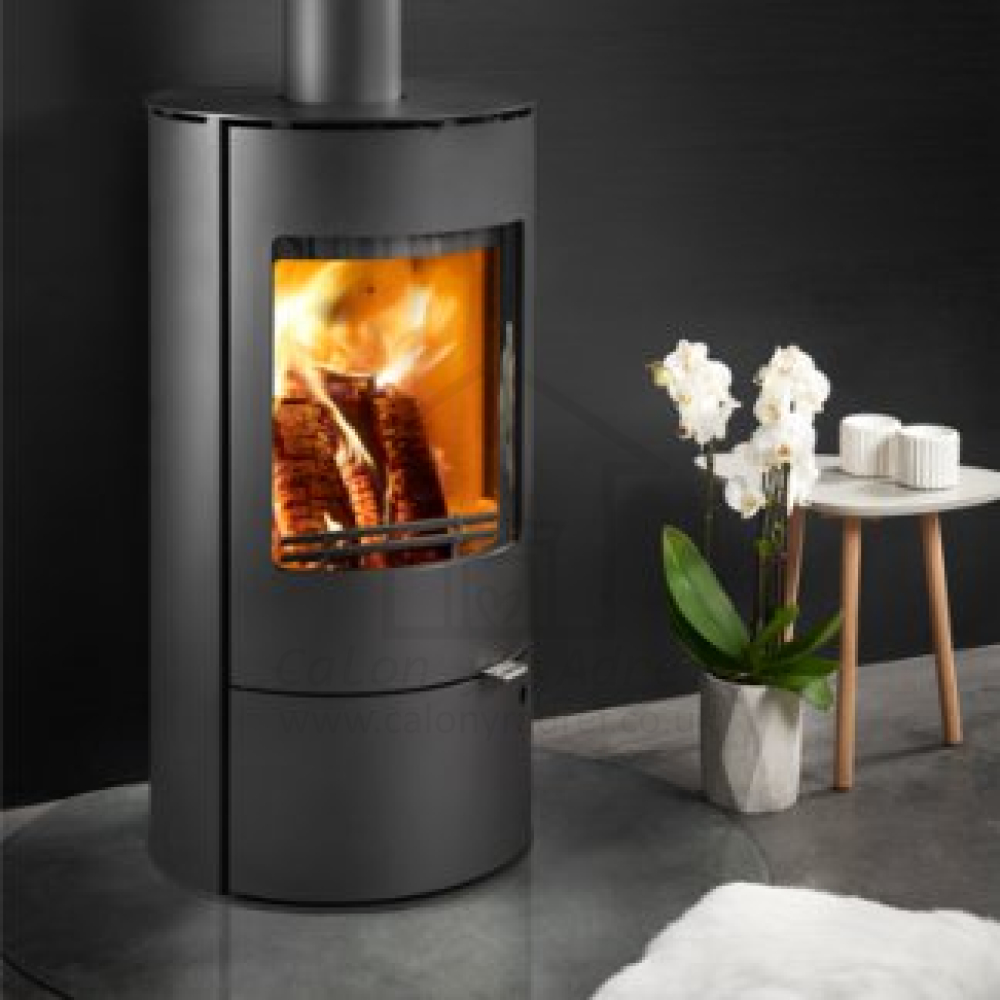 Westfire Uniq 36 Cylindrical Ecodesign Wood Stove on Closed Log Store